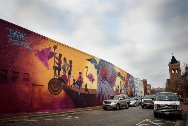 A mural by artist Dare Coulter is located on the Capitol Encore Academy building on Old Street.
