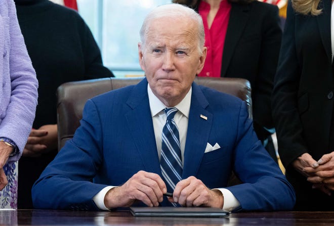 US President Joe Biden looks on after signing a Presidential Memorandum establishing the first-ever White House Initiative on Women's Health Research, in the Oval Office of the White House in Washington, DC, on November 13, 2023.