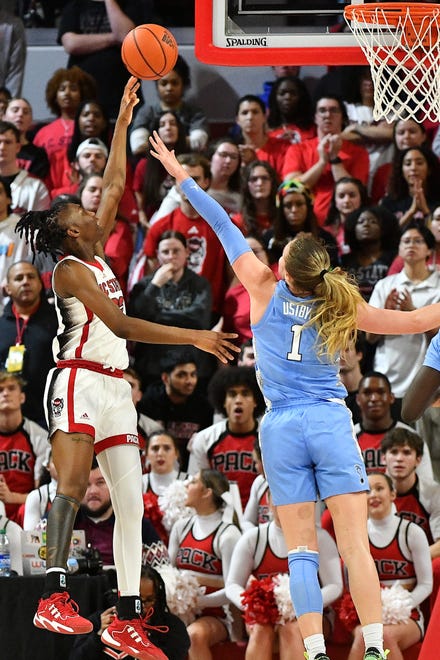 N.C State's Saniya Rivers (22) launches the shot over North Carolina's Alyssa Ustby (1) during the first half. The N.C. State Wolfpack and the North Carolina Tar Heels met in a regular-season game in Raleigh, N.C., on Feb. 1, 2024.