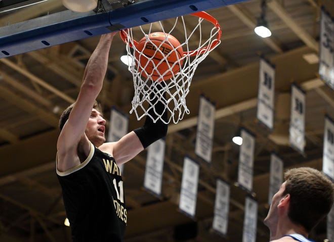 Feb 12, 2024; Durham, North Carolina, USA; Wake Forest Deamon Deacons forward Andrew Carr (11) dunks the ball during the first half against the Duke Blue Devils at Cameron Indoor Stadium. Mandatory Credit: Rob Kinnan-USA TODAY Sports