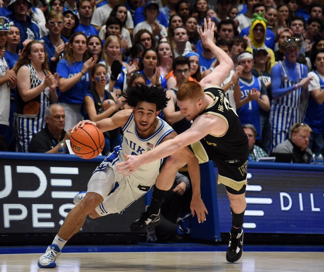 Feb 12, 2024; Durham, North Carolina, USA; Duke Blue Devils guard Jared McCain (0) is fouled by Wake Forest Deamon Deacons guard Cameron Hildreth (2) during the second half at Cameron Indoor Stadium. The Blue Devils won 77-69. Mandatory Credit: Rob Kinnan-USA TODAY Sports