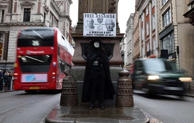 February 21, 2024: A demonstrator holds a placard reading "A Wikileak a day keeps Tyranny at Bay" as they protest near of the Royal Courts of Justice, Britain's High Court, in central London on the second day of a UK appeal by WikiLeaks founder Julian Assange against his extradition to the US. Lawyers for the United States on Wednesday urged a UK court to block a last-ditch bid by Julian Assange to appeal his extradition there to face espionage charges.