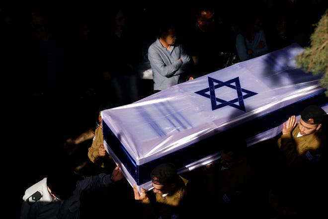 February 26, 2024: Soldiers carry the coffin during the funeral for Sgt. Oz Daniel in Kfar Saba, Israel. The Israel Defense Forces recently announced the death of Daniel, who served in the 7th Armored Brigade's 77th Battalion, and who was previously listed as one of the hostages taken to Gaza on October 7th. New information led the IDF to confirm he was killed on Oct. 7 and his body was taken by Hamas.