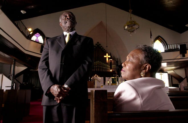 Dr. Lawrence Miller, left, pastor at Evans Metropolitan AME Zion Church, and Dr. Annette Billie, chair of archives/artifact committee will help host a unity service with different Methodist groups next week as part of the annual Methodist conference. They are pictured in the sanctuary of the church in 2001.