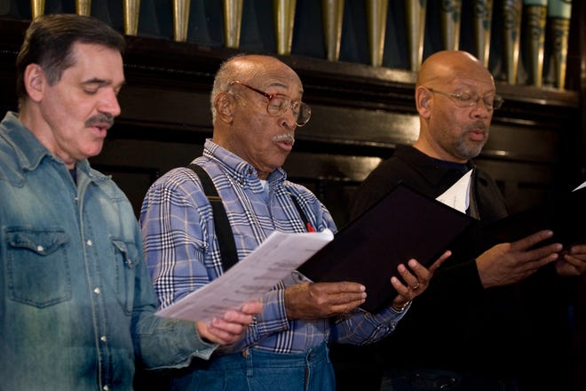 Terry L. Levitt, Wilton C. Jones and Lorenzo Jones rehearse with the HASM Community Choir under the direction of Helene G. Smith at the Evans Metropolitan AME Zion Church on Thursday, Feb. 9, 2012.