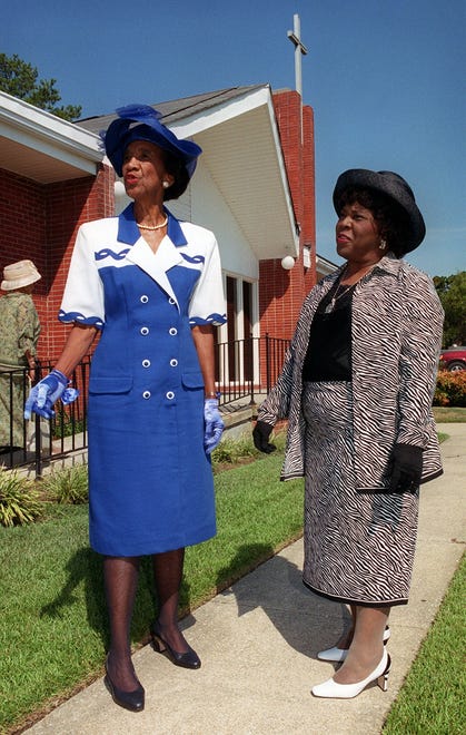 JoAnn Bishop and Margaret Morrow pause a moment before going into Mt. Sinai Baptist Church, Sunday morning, Aug. 11, 2002.