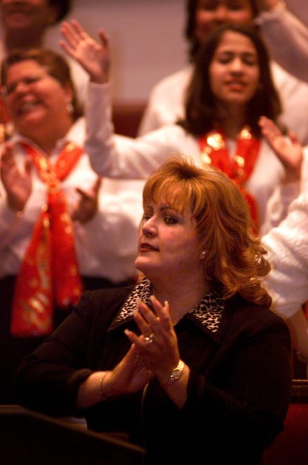 Rev. Wanda Rolon of Puerto Rico sings with a choir at Lewis Chapel Baptist Church Thursday, Nov. 30, 1999.