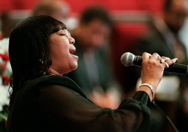 Cynthia Wade sings 'He looks Beyond My Faults" Thursday, October. 12, 2000, during the opening ceremonies of the NC NAACP convention at Lewis Chapel Baptist Church.