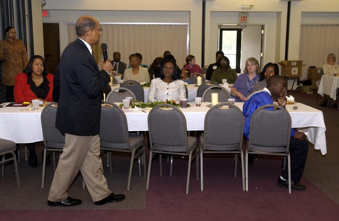 Rev. Wilbert Talley speaks in the fellowship hall at Lewis Chapel Baptist Church Monday, Nov. 22, 2004. Rev. Wilbert Talley was speaking about a new program, One Church One Child, that encourages churches to inform their congregation about adoption.