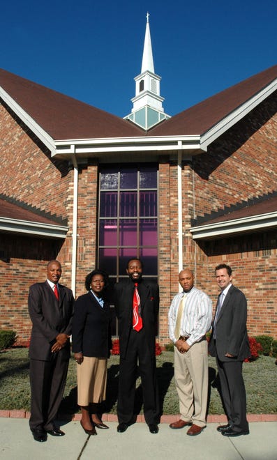 From left: Dr. Allen S. McLaughlin, THD., Patricia Timmons-Goodson, Calvin Pope, Lewis Chapel Music Minister Daryl Brooks , and Senior Pastor at Manna Church Michael Fletcher stand in front of Lewis Chapel Baptist Church in 2006.