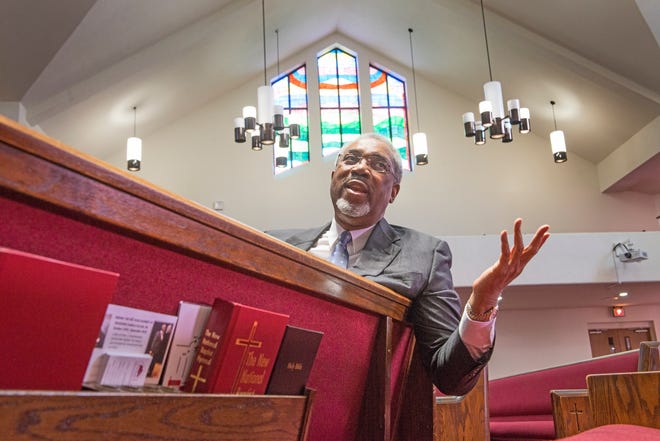 Long time Lewis Chapel Missionary Baptist Church Pastor Rev. John D. Fuller is retiring. He is shown here in the church sanctuary Monday, Dec. 7, 2015.