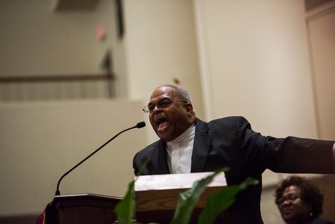 Pastor Cureton Johnson of First Baptist Church conducts the gospel message Sunday night Jan. 15, 2017 during the Fayetteville Cumberland County Ministerial Council's Martin Luther King Jr. worship service at Lewis Chapel Missionary Baptist Church in Fayetteville.