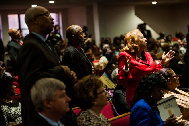 Congregation members listen to the scripture message Sunday night Jan. 15, 2017 during the Fayetteville Cumberland County Ministerial Council's Martin Luther King Jr. worship service at Lewis Chapel Missionary Baptist Church in Fayetteville.