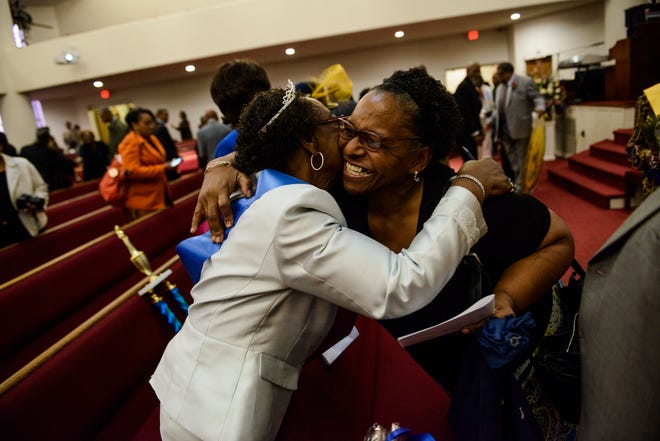 Church members congratulate Dollie Manigo, at left, after she was crowned the 2017 Mother of the Year on Sunday April 23, 2017 at Lewis Chapel Missionary Baptist Church.