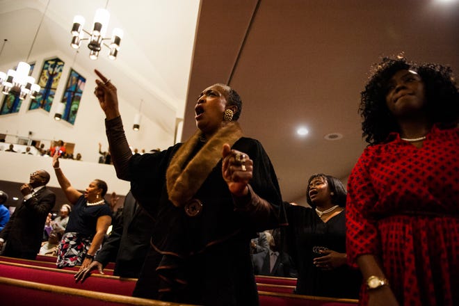 Congregation member Katherine Harley participates in the gospel worship service Sunday night Jan. 15, 2017 during the Fayetteville Cumberland County Ministerial Council's Martin Luther King Jr. worship service at Lewis Chapel Missionary Baptist Church in Fayetteville.