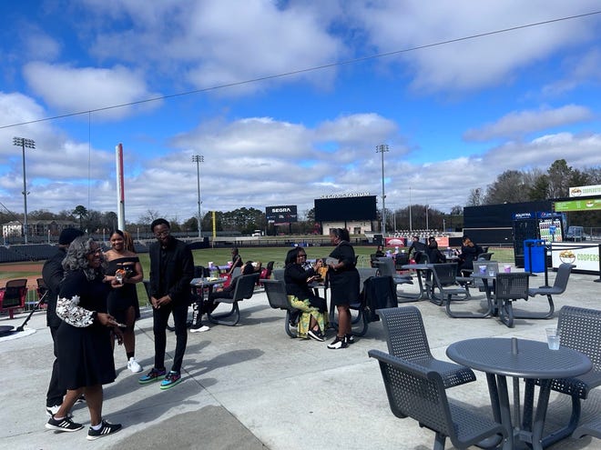 More than a dozen people outside wearing all black at the  3rd annual It's a Family Affair Sneaker Ball event at Segra Stadium, Mar. 2, 2024.