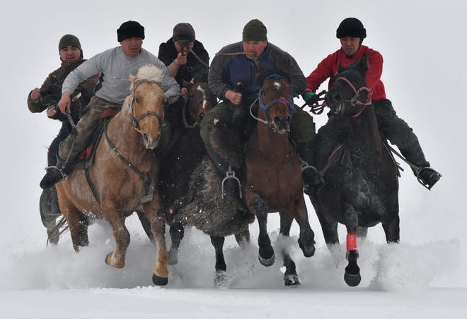 March 3, 2024: Riders compete in the traditional Central Asian sport of Kok-Boru (Gray Wolf) or Buzkashi (Goat Grabbing) in the village of Uch-Emchek, some 30kms from Bishkek, Kyrgyzstan. Mounted players compete for points by throwing a stuffed sheepskin into a well.