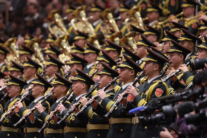 March 5, 2024 : Members of the Chinese People's Liberation Army band hold their brass instruments during opening of the second session of the 14th National People's Congress at The Great Hall of People in Beijing, China.China's annual political gathering known as the Two Sessions will convene leaders and lawmakers to set the government's agenda for domestic economic and social development for the year.