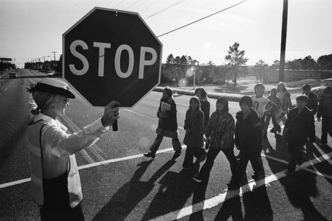 Crossing guard at Ramsey Street School on Dec. 11, 1973.