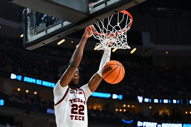 Texas Tech's Warren Washington dunks against NC State during the first half in the first round of the NCAA Men's Basketball Tournament, Thursday, March 21, 2024, at PPG PAINTS Arena in Pittsburgh, Pennsylvania.