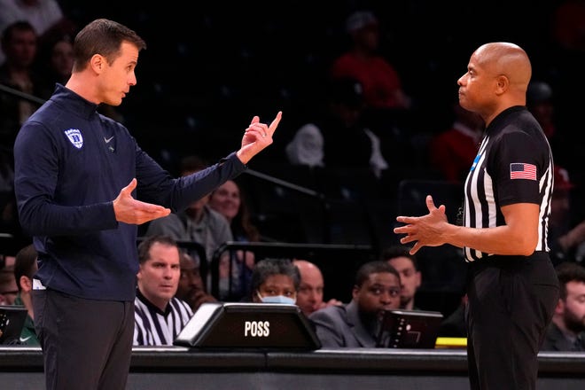 Mar 22, 2024; Brooklyn, NY, USA; Duke Blue Devils head coach John Scheyer reacts with the referee in the first round of the 2024 NCAA Tournament against the Vermont Catamounts at the Barclays Center. Mandatory Credit: Robert Deutsch-USA TODAY Sports