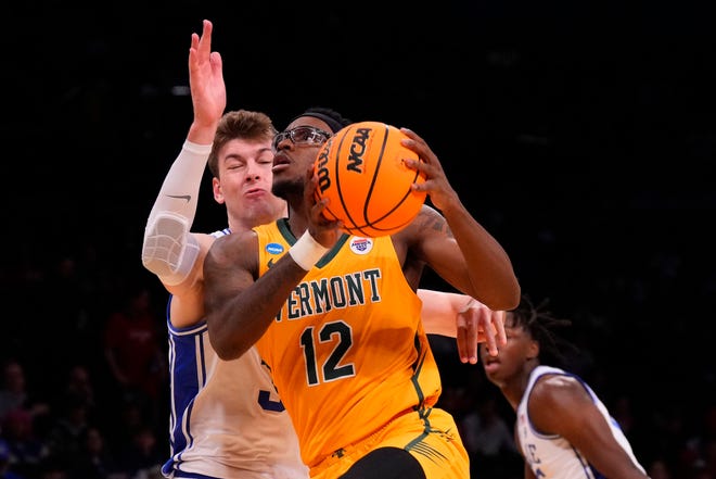 Mar 22, 2024; Brooklyn, NY, USA; Vermont Catamounts guard Shamir Bogues (12) shoots the ball against the Duke Blue Devils in the first round of the 2024 NCAA Tournament at the Barclays Center. Mandatory Credit: Robert Deutsch-USA TODAY Sports