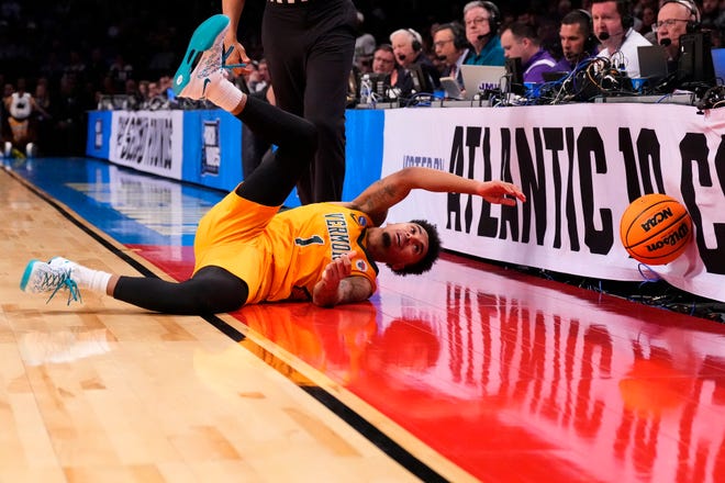 Mar 22, 2024; Brooklyn, NY, USA; Vermont Catamounts guard Aaron Deloney (1) attempts to get a ball against the Duke Blue Devils in the first round of the 2024 NCAA Tournament at the Barclays Center. Mandatory Credit: Robert Deutsch-USA TODAY Sports