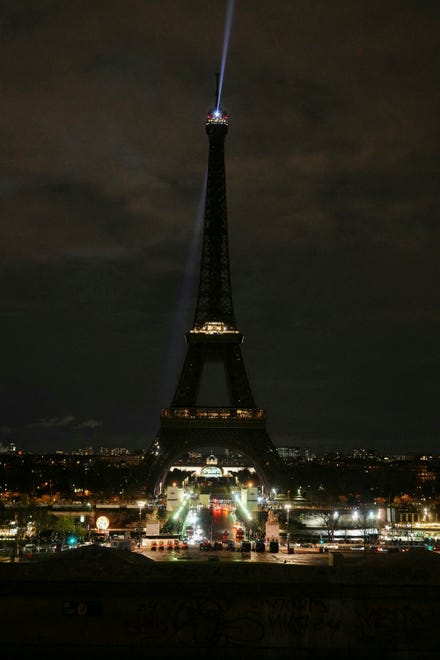 March 23, 2024: This photograph taken in Paris, on shows the Eiffel tower with the lights off during the Earth Hour environmental campaign.