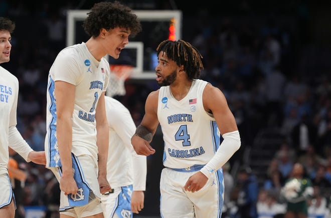 North Carolina Tar Heels guard RJ Davis (4) and North Carolina Tar Heels forward Zayden High (1) react against the Michigan State Spartans in the second round of the 2024 NCAA Tournament on Saturday at the Spectrum Center in Charlotte, N.C.
