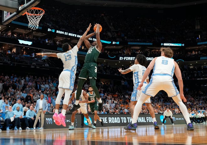 Michigan State Spartans center Mady Sissoko (22) shoots over North Carolina Tar Heels forward Jalen Washington (13) in the second round of the 2024 NCAA Tournament on Saturday at the Spectrum Center in Charlotte, N.C.