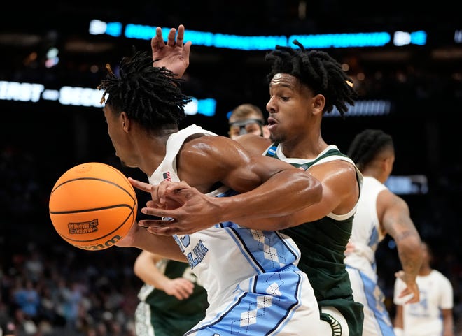 March 23, 2024, Charlotte, NC, USA; North Carolina Tar Heels forward Harrison Ingram (55) loses the ball against Michigan State Spartans guard A.J. Hoggard (11) in the second round of the 2024 NCAA Tournament on Saturday at the Spectrum Center in Charlotte, N.C.
