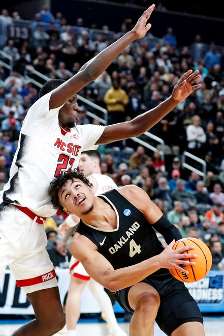 Mar 23, 2024; Pittsburgh, PA, USA; Oakland Golden Grizzlies forward Trey Townsend (4) drives to the basket against North Carolina State Wolfpack forward Mohamed Diarra (23) during the first half in the second round of the 2024 NCAA Tournament at PPG Paints Arena. Mandatory Credit: Charles LeClaire-USA TODAY Sports