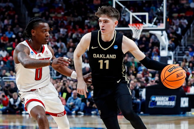 Mar 23, 2024; Pittsburgh, PA, USA; Oakland Golden Grizzlies guard Blake Lampman (11) drives to the basket against North Carolina State Wolfpack guard DJ Horne (0) during the first half in the second round of the 2024 NCAA Tournament at PPG Paints Arena. Mandatory Credit: Charles LeClaire-USA TODAY Sports