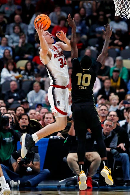Mar 23, 2024; Pittsburgh, PA, USA; North Carolina State Wolfpack forward Ben Middlebrooks (34) shoots the ball against Oakland Golden Grizzlies guard DQ Cole (10) during the first half in the second round of the 2024 NCAA Tournament at PPG Paints Arena. Mandatory Credit: Charles LeClaire-USA TODAY Sports