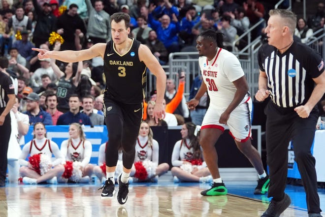 Mar 23, 2024; Pittsburgh, PA, USA; Oakland Golden Grizzlies guard Jack Gohlke (3) celebrates after making a three point during the first half of the game against the North Carolina State Wolfpack in the second round of the 2024 NCAA Tournament at PPG Paints Arena. Mandatory Credit: Gregory Fisher-USA TODAY Sports