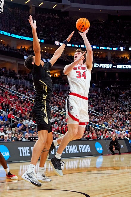Mar 23, 2024; Pittsburgh, PA, USA; North Carolina State Wolfpack forward Ben Middlebrooks (34) shoots the ball against Oakland Golden Grizzlies forward Trey Townsend (4) during the first half in the second round of the 2024 NCAA Tournament at PPG Paints Arena. Mandatory Credit: Gregory Fisher-USA TODAY Sports