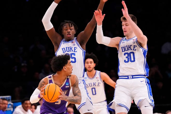 Mar 24, 2024; Brooklyn, NY, USA; James Madison Dukes guard Terrence Edwards Jr. (5) attempts to shoot the ball over Duke Blue Devils forward Mark Mitchell (25) and center Kyle Filipowski (30) in the second round of the 2024 NCAA Tournament at Barclays Center. Mandatory Credit: Robert Deutsch-USA TODAY Sports