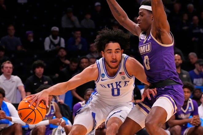 Mar 24, 2024; Brooklyn, NY, USA; Duke Blue Devils guard Jared McCain (0) dribbles the ball past James Madison Dukes guard Xavier Brown (0) in the second round of the 2024 NCAA Tournament at Barclays Center. Mandatory Credit: Robert Deutsch-USA TODAY Sports