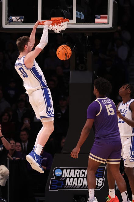 Mar 24, 2024; Brooklyn, NY, USA; Duke Blue Devils center Kyle Filipowski (30) dunks the ball against the James Madison Dukes in the second round of the 2024 NCAA Tournament at Barclays Center. Mandatory Credit: Brad Penner-USA TODAY Sports