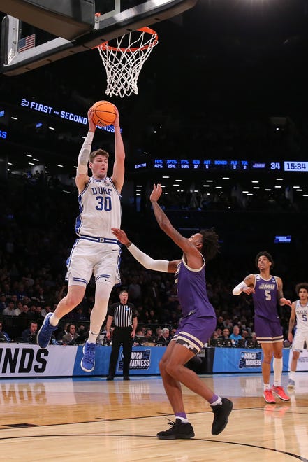 Mar 24, 2024; Brooklyn, NY, USA; Duke Blue Devils center Kyle Filipowski (30) shoots the ball against the James Madison Dukes in the second round of the 2024 NCAA Tournament at Barclays Center. Mandatory Credit: Brad Penner-USA TODAY Sports