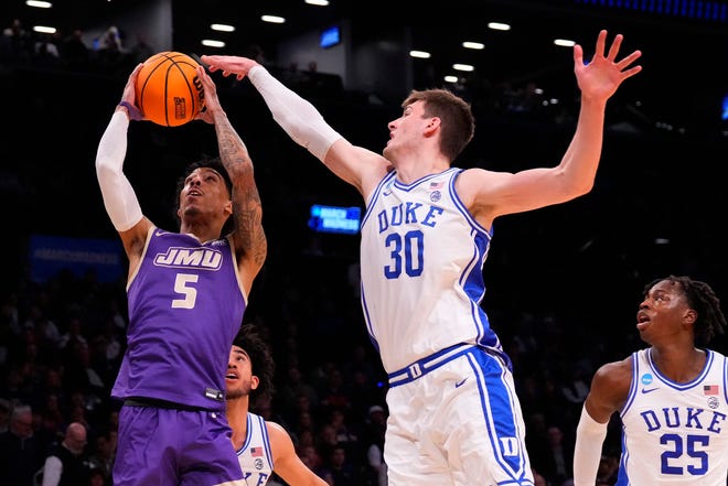 Mar 24, 2024; Brooklyn, NY, USA; James Madison Dukes guard Terrence Edwards Jr. (5) shoots the ball over Duke Blue Devils center Kyle Filipowski (30) in the second round of the 2024 NCAA Tournament at Barclays Center. Mandatory Credit: Robert Deutsch-USA TODAY Sports