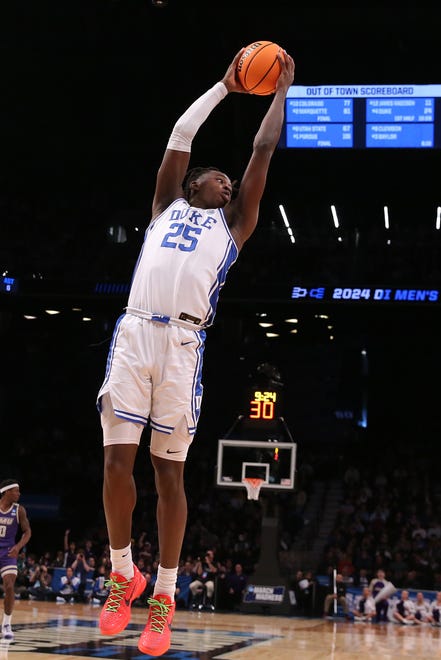 Mar 24, 2024; Brooklyn, NY, USA; Duke Blue Devils forward Mark Mitchell (25) grabs a rebound against the James Madison Dukes in the second round of the 2024 NCAA Tournament at Barclays Center. Mandatory Credit: Brad Penner-USA TODAY Sports