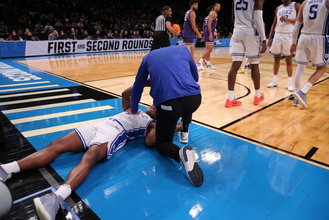 Mar 24, 2024; Brooklyn, NY, USA; Duke Blue Devils guard Jaylen Blakes (2) is tended to by the Duke Blue Devils medical staff after a foul against the James Madison Dukes in the second round of the 2024 NCAA Tournament at Barclays Center. Mandatory Credit: Brad Penner-USA TODAY Sports