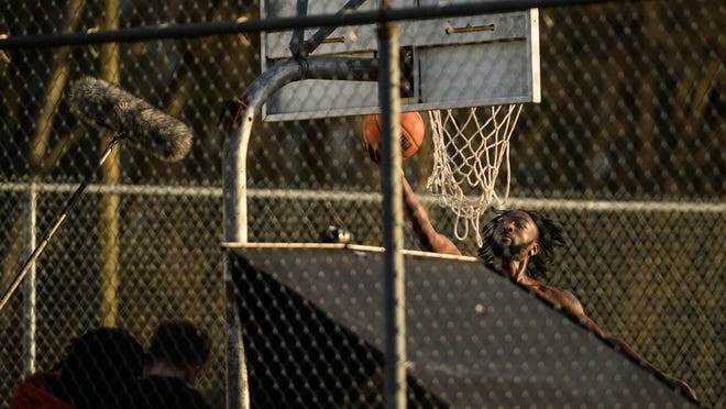 Actors are filmed playing basketball for a J. Cole project near Walker-Spivey Elementary School on Thursday, Jan. 9, 2020.