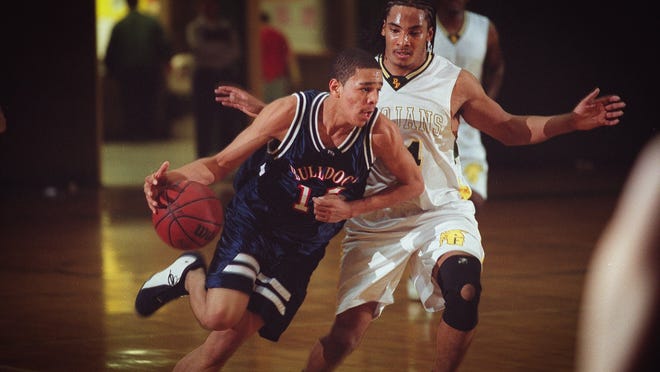 Terry Sanford's Jermaine Cole drives by Pine Forest's  Robert Dowdy during the first half on Tuesday, Jan. 7, 2003, in Fayetteville, N.C.